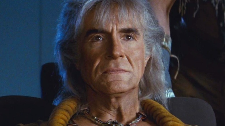 Khan Noonien Singh seated stoic