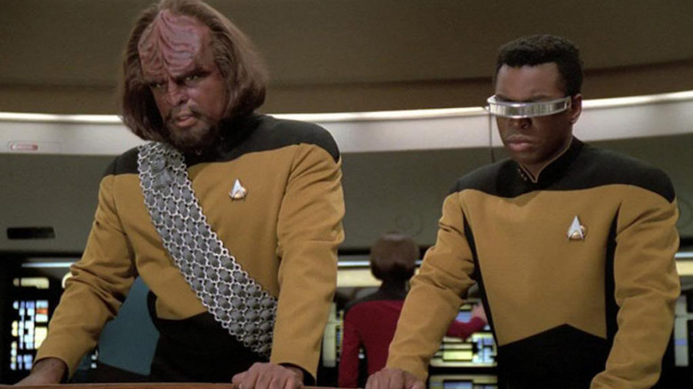 Worf and Geordi behind the tactical arch in Star Trek: The Next Generation