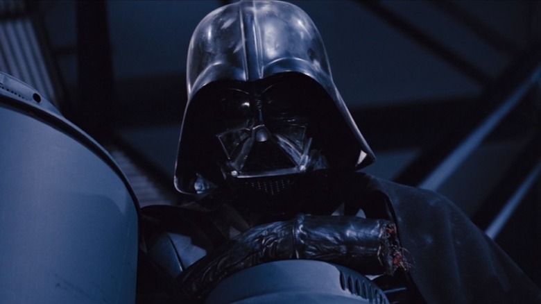 Darth Vader leaning on post
