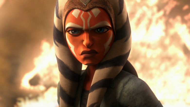 Ahsoka Tano stands near fire