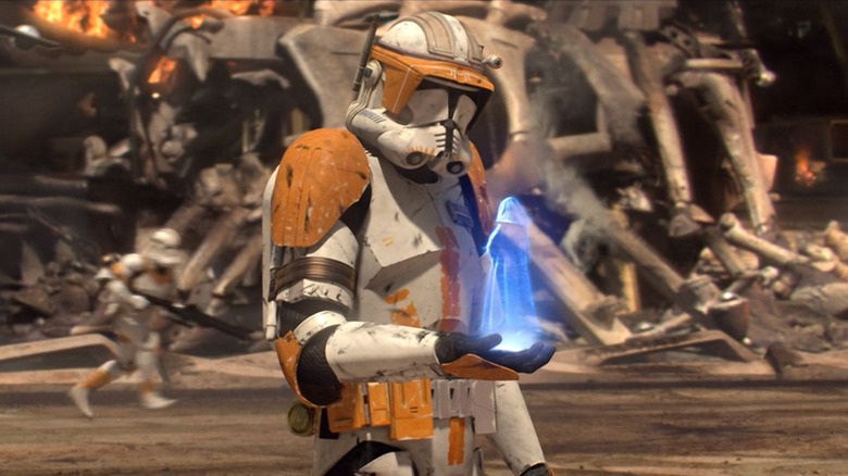 Commander Cody holding Emperor hologram
