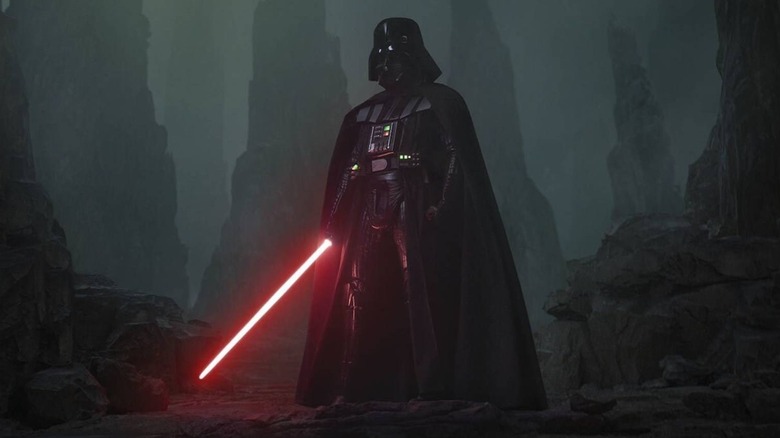 Darth Vader holding a lightsaber