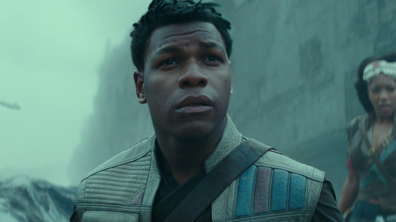 Finn and Jannah standing near the wreckage of the second Death Star in Star Wars: Episode IX — The Rise of Skywalker (2019)