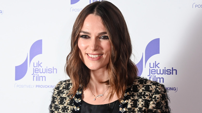 Knightley poses for photos at a red carpet premiere