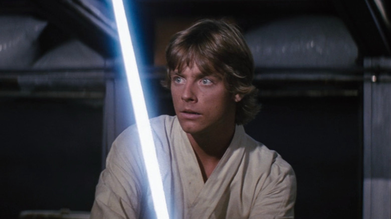 Luke Skywalker wielding a lightsaber