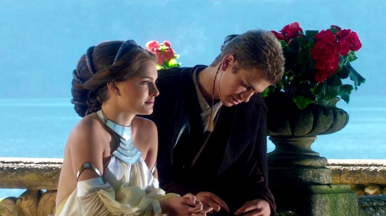 Padme and Anakin leaning on railing