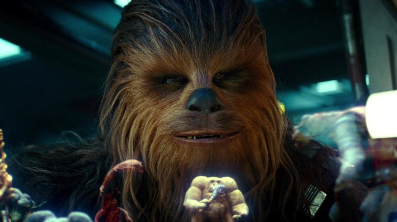 Chewbacca looking at the table in Star Wars: The Rise of Skywalker