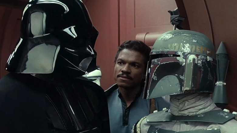 Darth Vader, Lando, and Boba Fett talking in The Empire Strikes Back