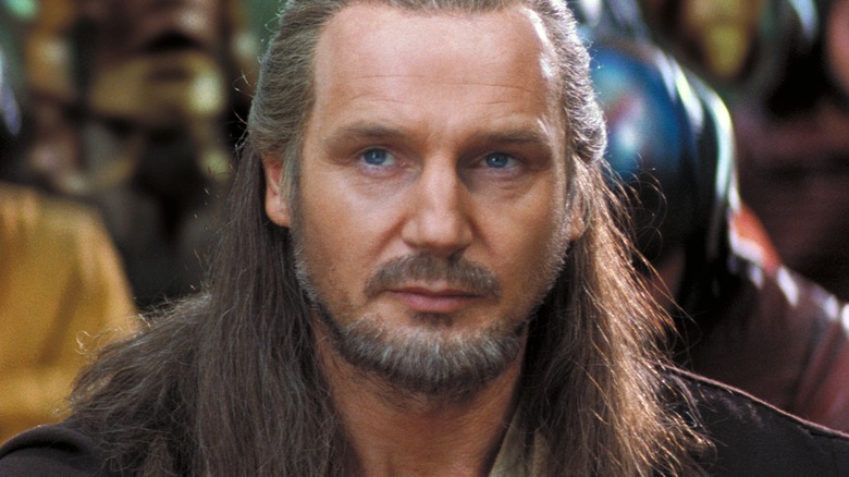 Liam Neeson as Qui-Gon staring