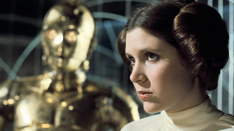 Princess Leia and C-3PO watch the battle unfold