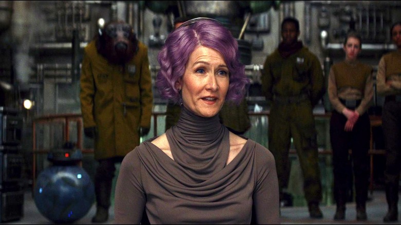 Holdo wearing a grey outfit
