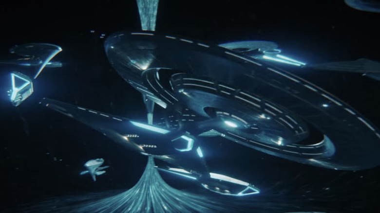 The Discovery flying in Federation Headquarters
