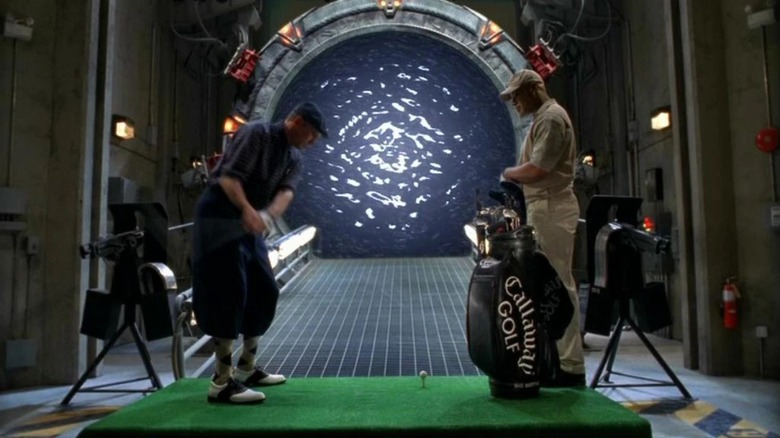 O'Neill and Teal'c playing golf into the Stargate in "Stargate SG-1"
