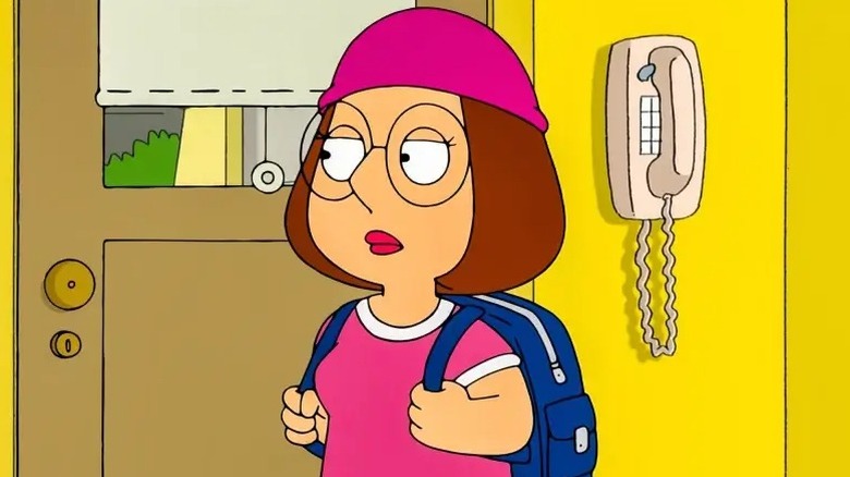 Meg holding her backpack
