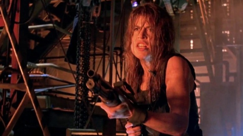 Sarah Connor firing a shotgun