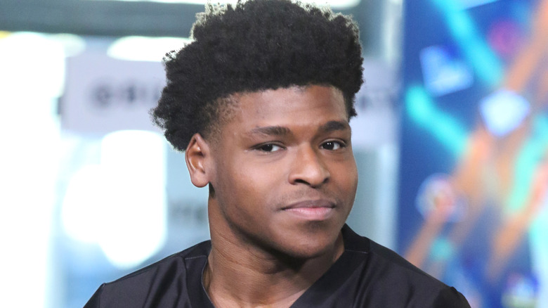 Jerry Harris sitting in a TV studio