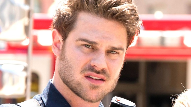 Grey Damon looking unhappy