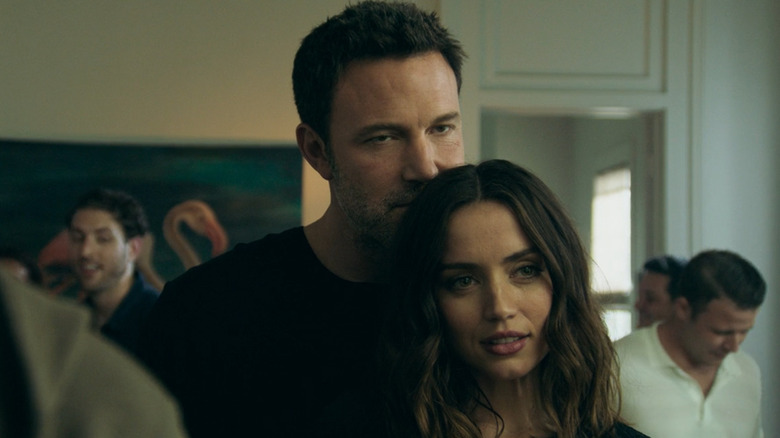 Vic presses his face to the back of Melinda's hair in Deep Water (2022)