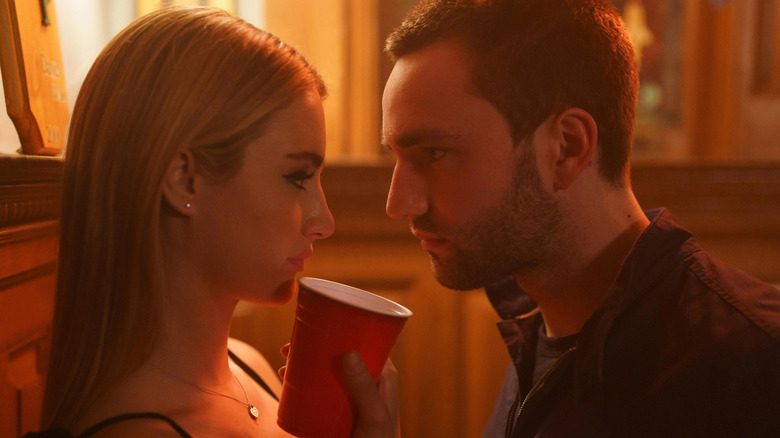 Lucy and Stephen looking at each other intensely in Tell Me Lies (2022)