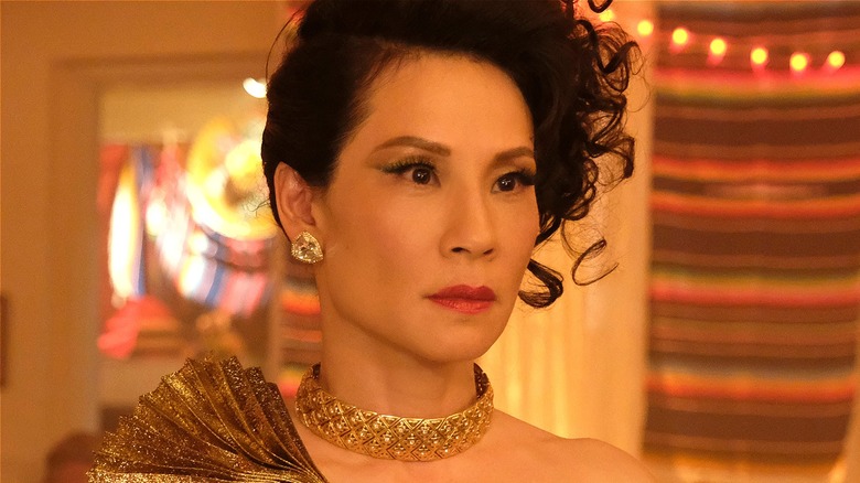 Simone dressed up looking concerned in Why Women Kill