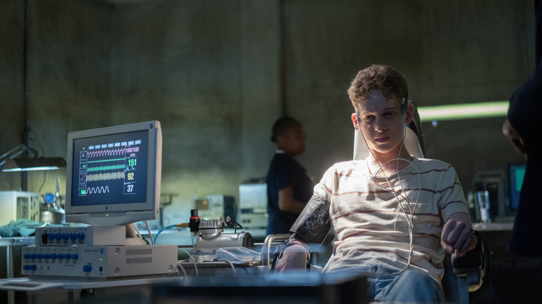 Luke Ellis strapped to a machine on The Institute