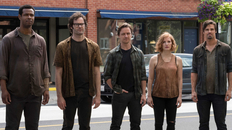 Adult Losers Club standing outside together in IT: Chapter 2 (2019)