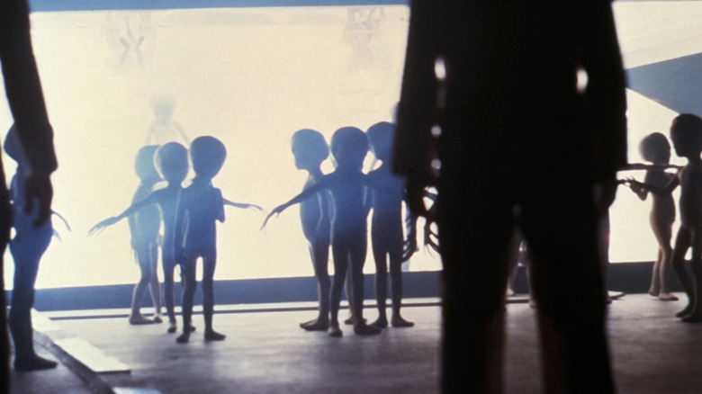 Aliens standing together in "Close Encounters of the Third Kind"