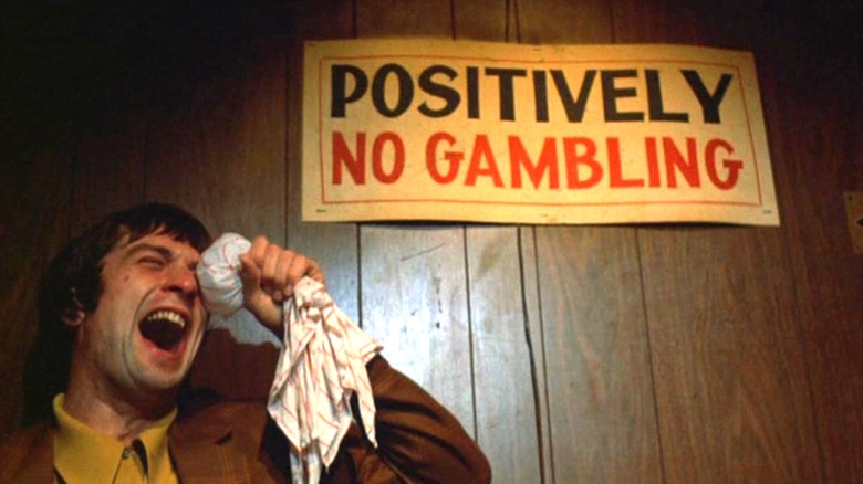 Johnny Boy cries in front of a "Positively No Gambling" sign in "Mean Streets"