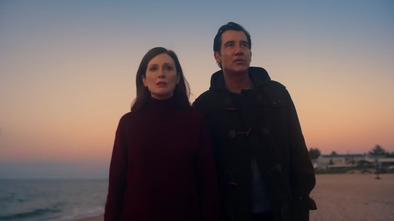 Lisey and Scott Landon standing on a beach at sunset, looking into the distance in "Lisey's Story"