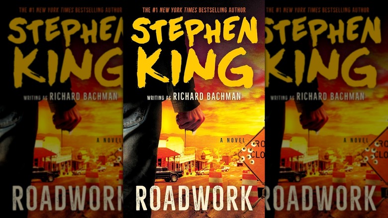 The book cover of "Roadwork" by Stephen King, showing a man balling his fist