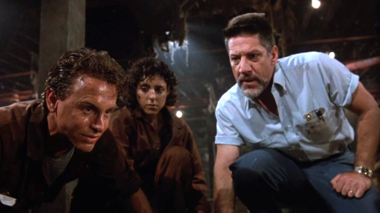 Hall, Wisconsky, and Warwick explore an underground shaft in Graveyard Shift (1990)