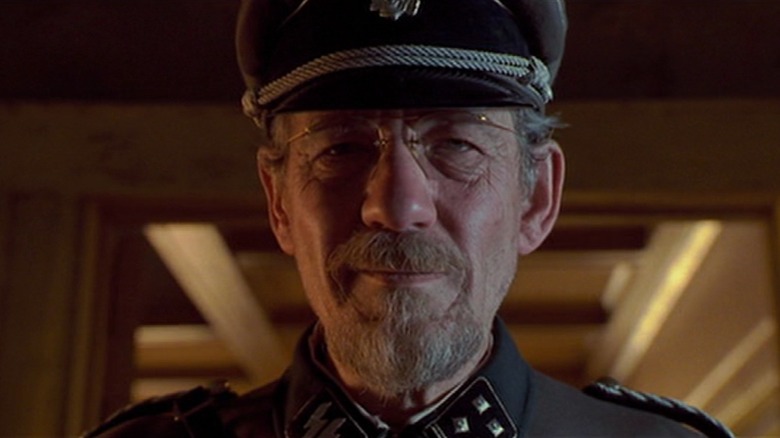 Kurt Dussander stand at attention in his Nazi uniform in "Apt Pupil" (1998)