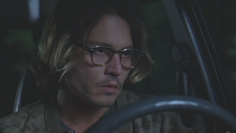 Mort Rainey sits in a darkened car in "Secret Window" (2004)