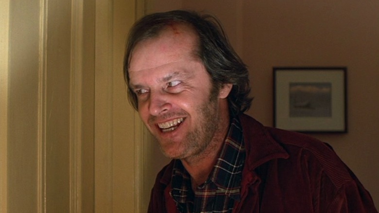 Jack Torrance stands outside his bedroom door in "The Shining" (1980)
