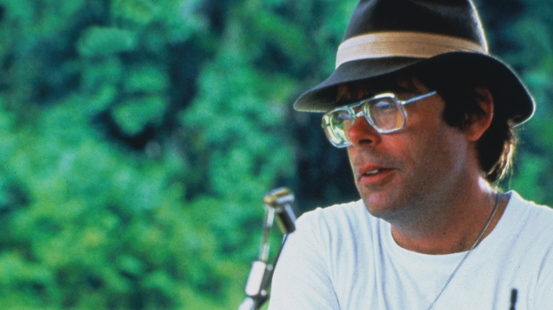 A young Stephen King with big glasses and a fedora