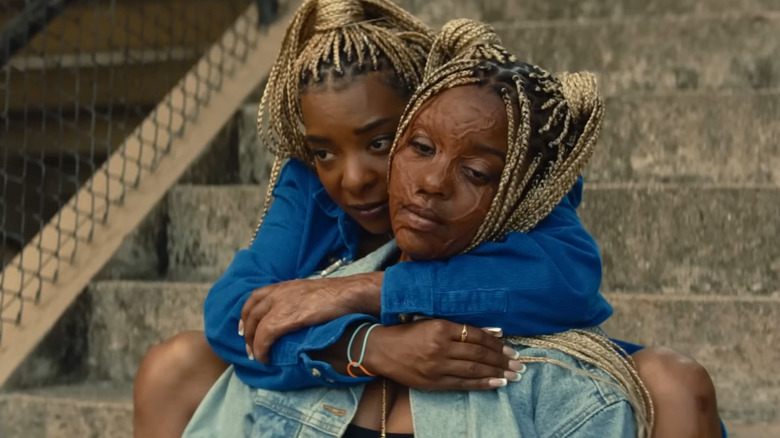 Racine and Anaia sitting together in "Is God Is" (2026)