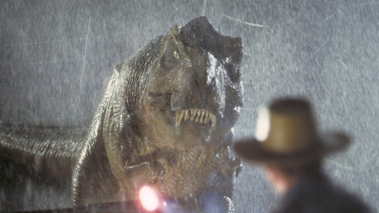 A T-Rex roaring in the rain in 