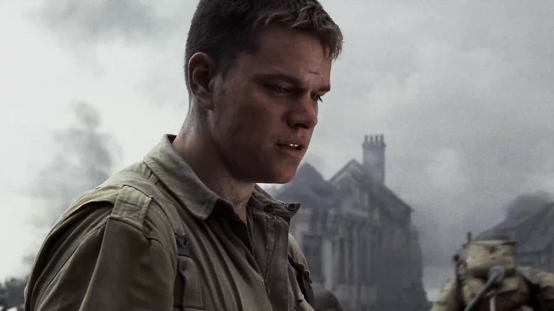 Ryan looking down in the middle of a battlefield in "Saving Private Ryan" (1998)