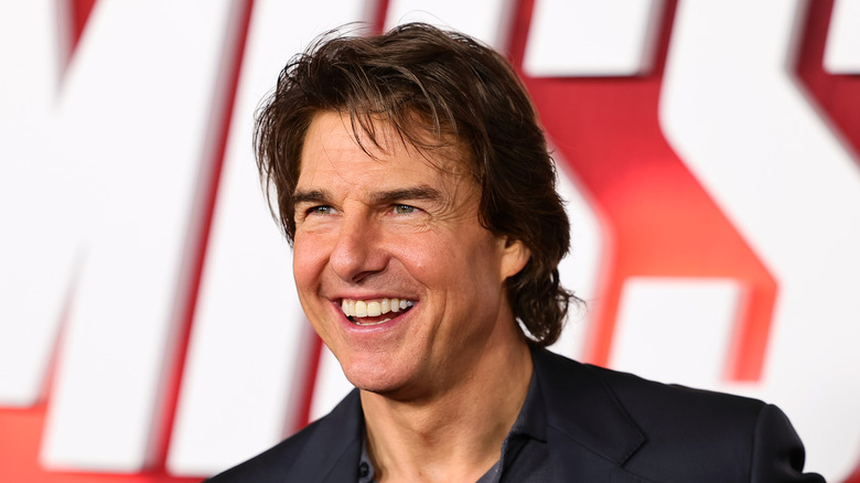 Tom Cruise smiling black jacket