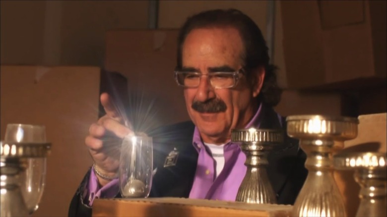 Moe Prigoff looking at a champagne glass