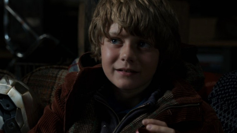 Ty Simpkins on a couch