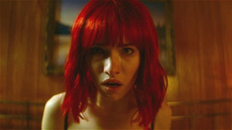 The Lady looking dazed in "Strange Darling" (2024)
