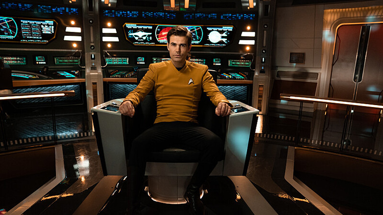 Kirk sitting in the captain's chair