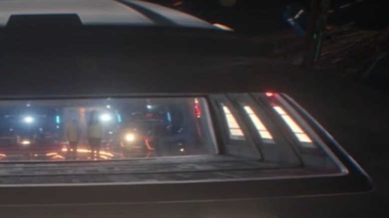 The TARDIS floating behind the Enterprise