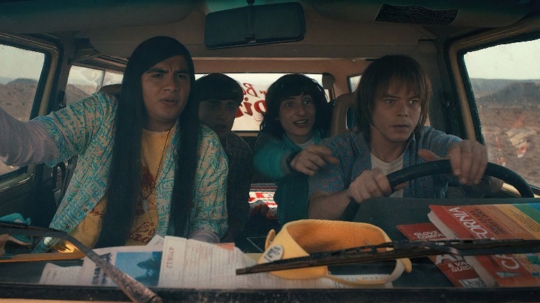 Argyle, Will Byers, Mike Wheeler, and Jonathan Byers driving down a road