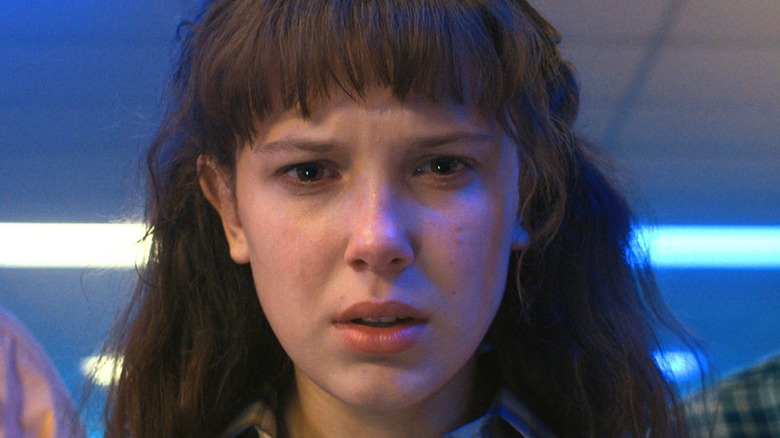 Eleven with brown hair and bangs