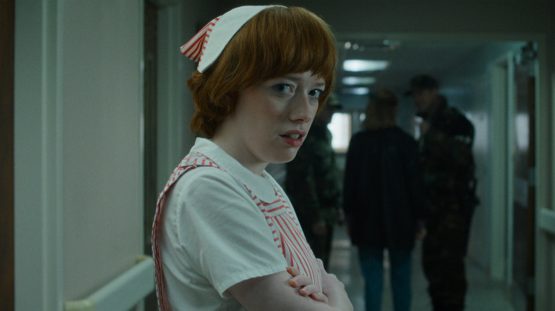 Vickie standing in a hospital hallway in Stranger Things