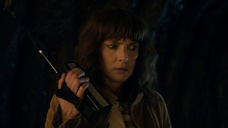 Jouyce Byers listens to a walkie talkie in "Stranger Things"