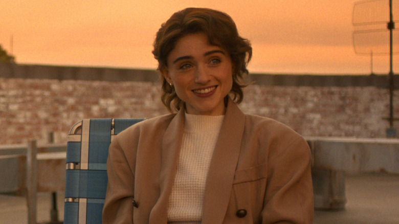 Nancy Wheeler smiling at friends in "Stranger Things"
