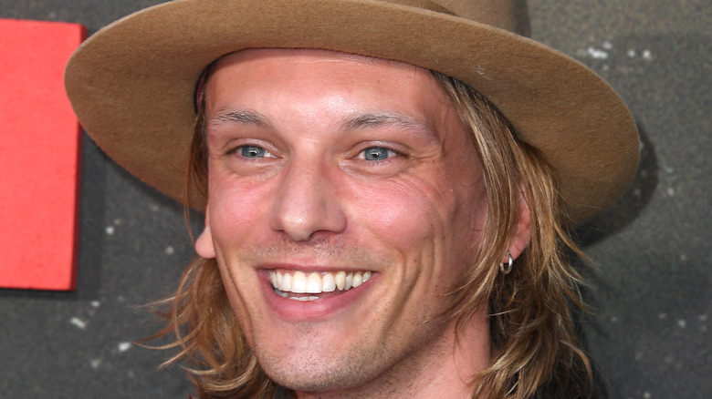 Jamie Campbell Bower smiling